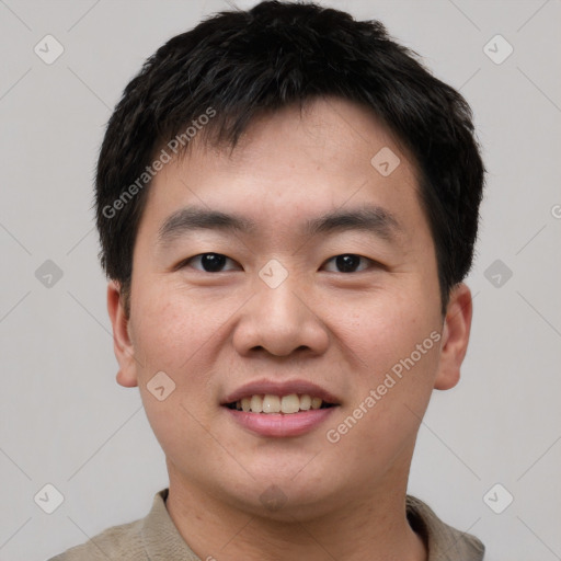 Joyful white young-adult male with short  black hair and brown eyes