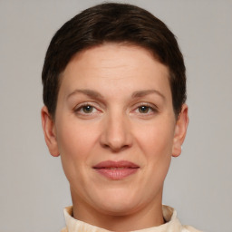 Joyful white adult female with short  brown hair and brown eyes