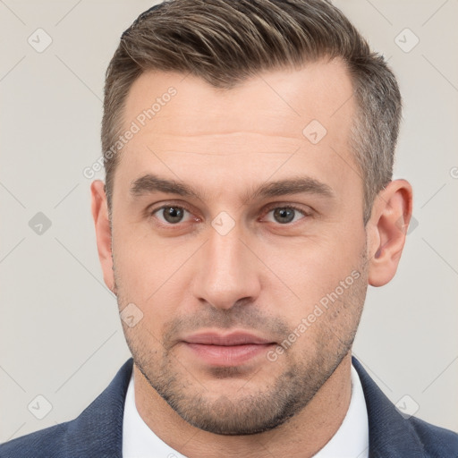 Neutral white young-adult male with short  brown hair and brown eyes