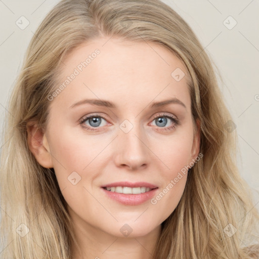 Joyful white young-adult female with long  brown hair and blue eyes