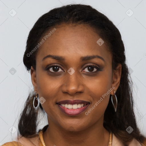 Joyful black young-adult female with long  brown hair and brown eyes