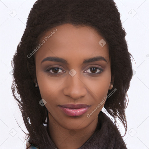 Joyful black young-adult female with long  brown hair and brown eyes