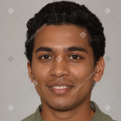 Joyful black young-adult male with short  black hair and brown eyes