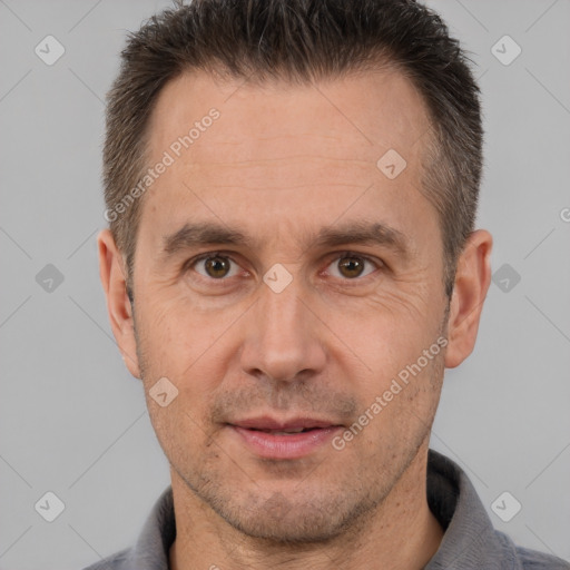 Joyful white adult male with short  brown hair and brown eyes