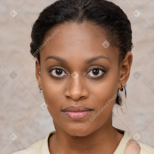 Joyful black young-adult female with short  brown hair and brown eyes