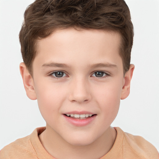 Joyful white child male with short  brown hair and brown eyes