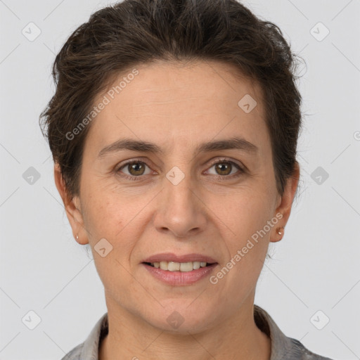 Joyful white adult female with short  brown hair and brown eyes