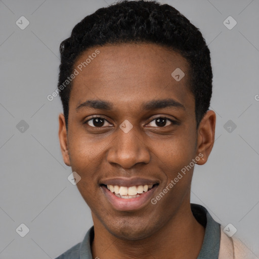 Joyful black young-adult male with short  black hair and brown eyes