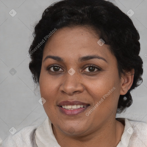 Joyful black adult female with short  brown hair and brown eyes