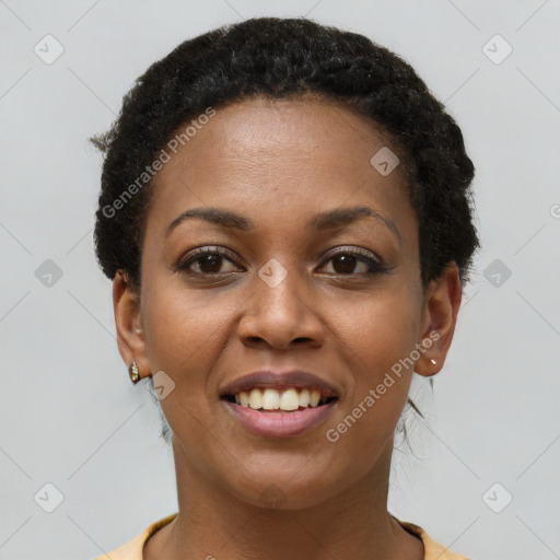 Joyful black young-adult female with short  brown hair and brown eyes