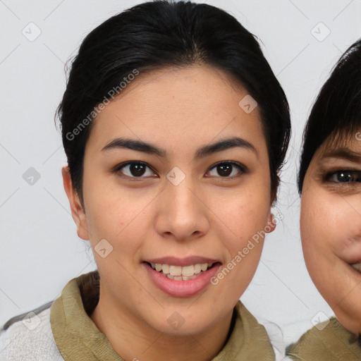 Joyful asian young-adult female with medium  brown hair and brown eyes