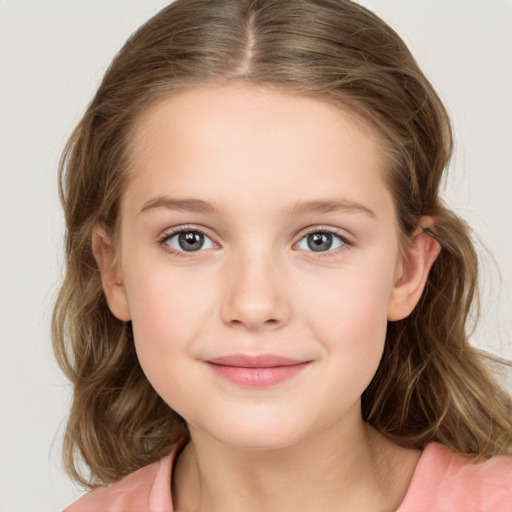 Joyful white child female with medium  brown hair and grey eyes