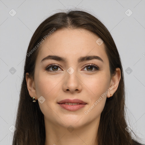 Joyful white young-adult female with long  brown hair and brown eyes