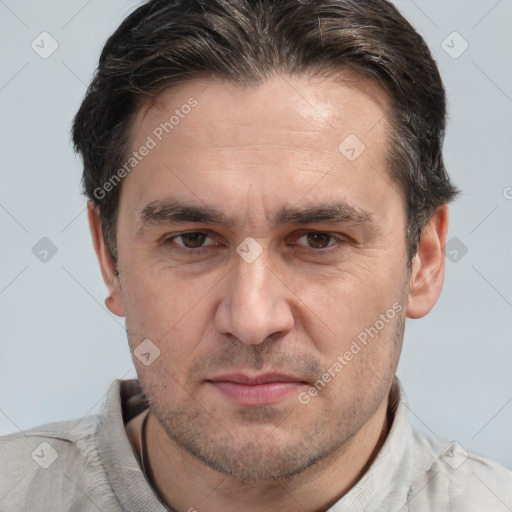 Joyful white adult male with short  brown hair and brown eyes