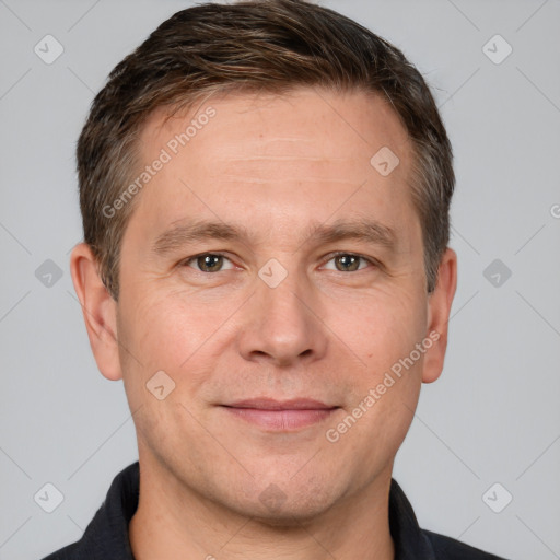 Joyful white adult male with short  brown hair and brown eyes