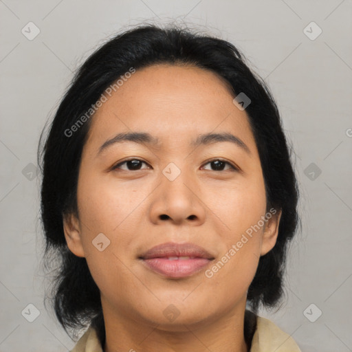 Joyful asian young-adult female with medium  brown hair and brown eyes