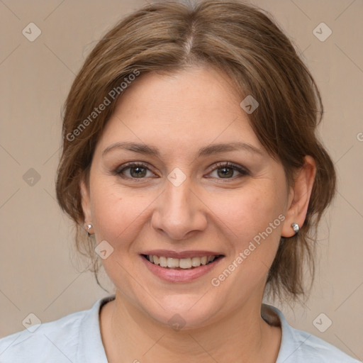 Joyful white adult female with medium  brown hair and brown eyes