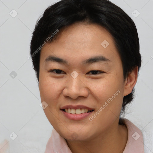 Joyful asian young-adult female with short  brown hair and brown eyes