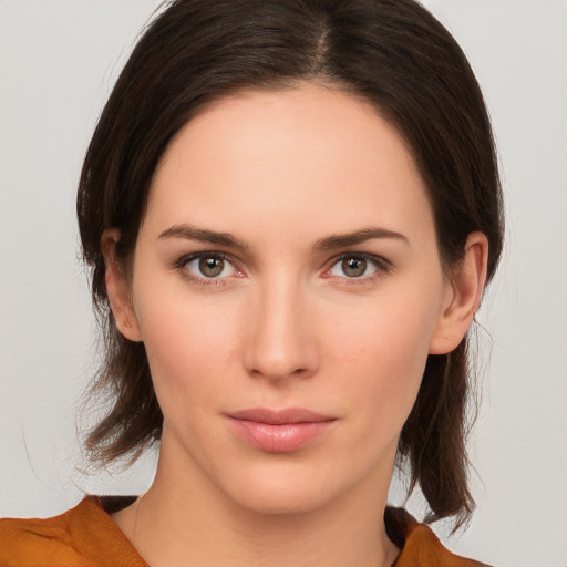 Neutral white young-adult female with medium  brown hair and brown eyes