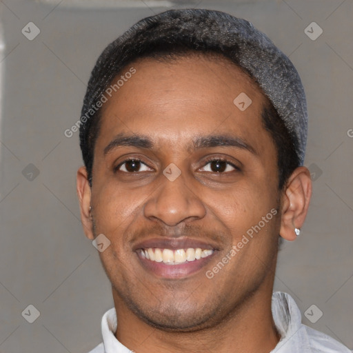 Joyful latino young-adult male with short  black hair and brown eyes