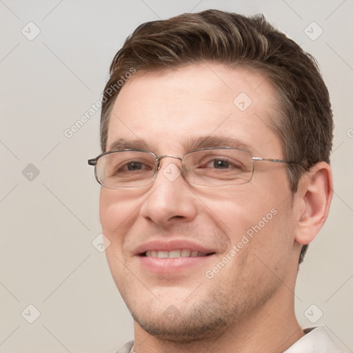 Joyful white adult male with short  brown hair and grey eyes