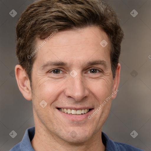 Joyful white adult male with short  brown hair and grey eyes