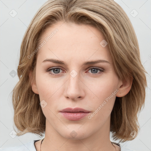 Joyful white young-adult female with medium  brown hair and green eyes