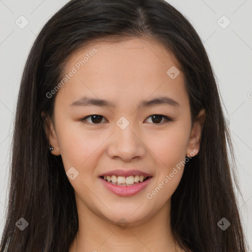 Joyful asian young-adult female with long  brown hair and brown eyes