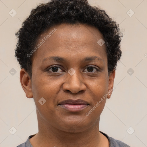 Joyful black adult female with short  brown hair and brown eyes