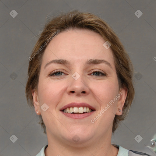 Joyful white adult female with medium  brown hair and grey eyes