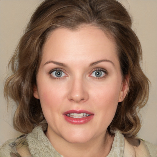 Joyful white young-adult female with medium  brown hair and green eyes