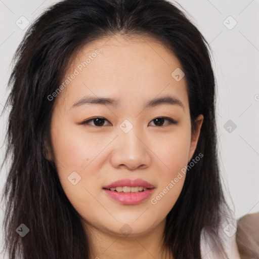 Joyful asian young-adult female with long  brown hair and brown eyes