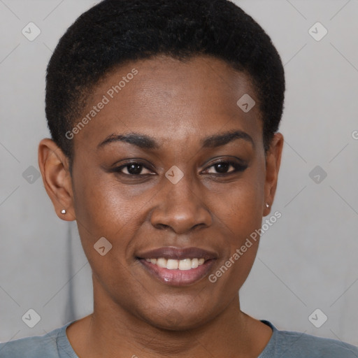 Joyful black young-adult female with short  brown hair and brown eyes