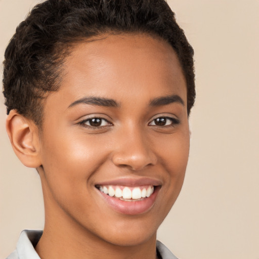 Joyful latino young-adult female with short  brown hair and brown eyes