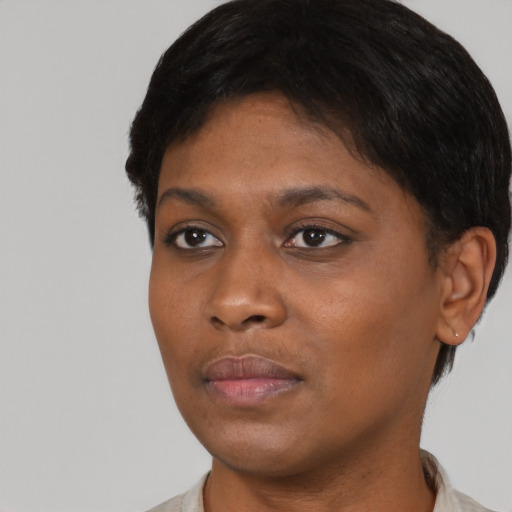 Neutral black young-adult female with short  black hair and brown eyes