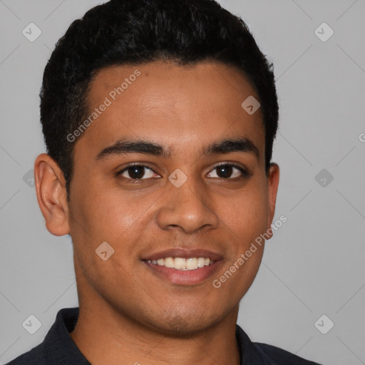 Joyful latino young-adult male with short  brown hair and brown eyes