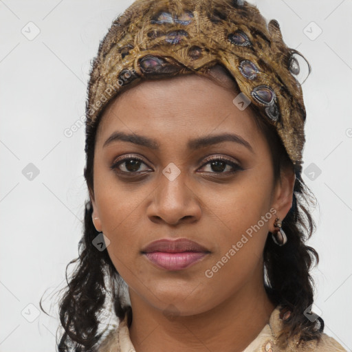 Joyful black young-adult female with long  brown hair and brown eyes