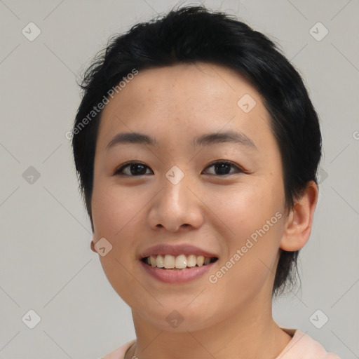 Joyful asian young-adult female with medium  black hair and brown eyes