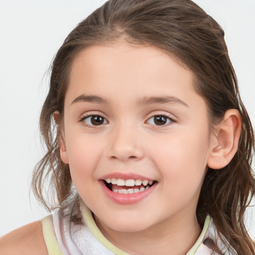 Joyful white child female with medium  brown hair and brown eyes