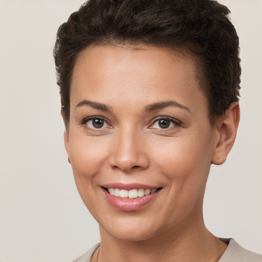 Joyful white young-adult female with short  brown hair and brown eyes