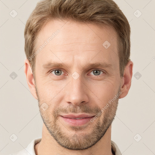 Joyful white adult male with short  brown hair and grey eyes