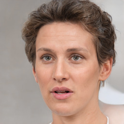 Joyful white adult female with short  brown hair and brown eyes