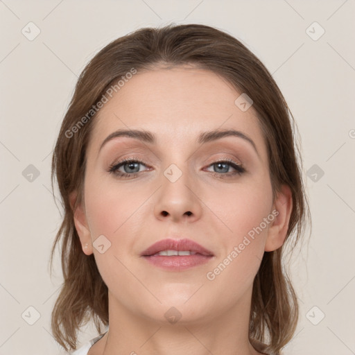 Joyful white young-adult female with medium  brown hair and grey eyes