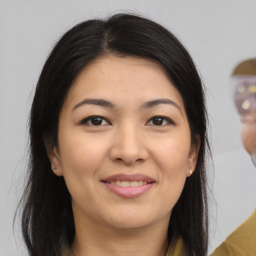 Joyful asian young-adult female with medium  brown hair and brown eyes