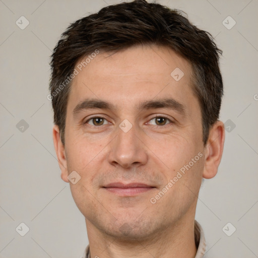 Joyful white adult male with short  brown hair and brown eyes