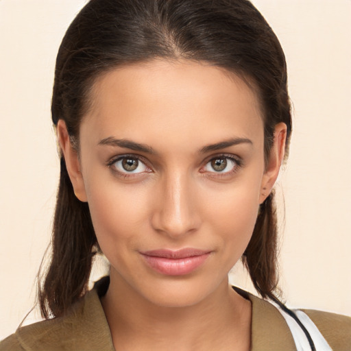 Joyful white young-adult female with medium  brown hair and brown eyes