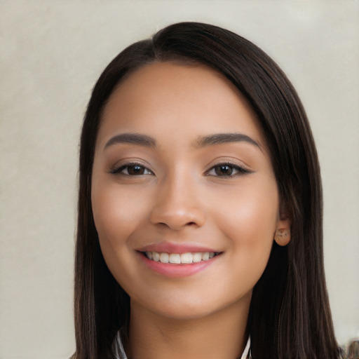 Joyful white young-adult female with long  black hair and brown eyes