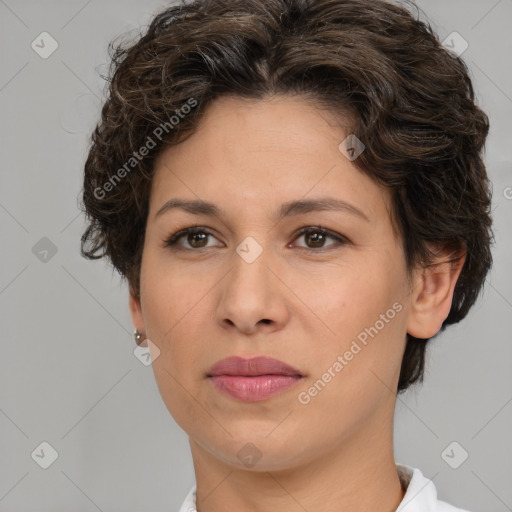 Joyful white adult female with short  brown hair and brown eyes