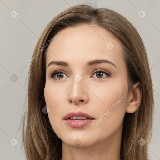 Neutral white young-adult female with long  brown hair and brown eyes