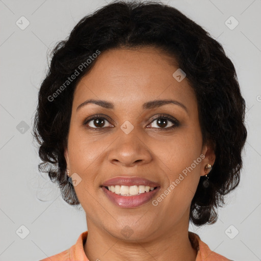 Joyful black young-adult female with long  brown hair and brown eyes